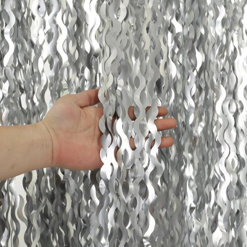 This is our wavy aluminum foil hanging screen. It's made from high-quality aluminum with a bright silver finish, featuring that beautiful flowing wave pattern that creates a modern and elegant look. Super lightweight and flexible, it’s perfect as a room divider, backdrop, or decorative wall feature. And the best part is we can fully customize this style — you can change the size, length, color, wave density, or even the pattern according to your space and design needs.