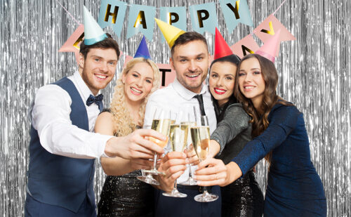 Shiny silver fringe curtain birthday backdrop with kids and cake celebration