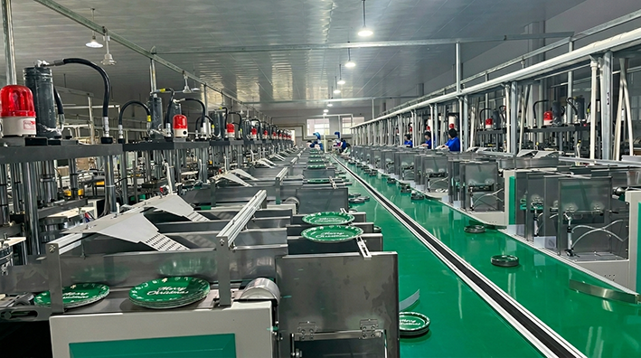 This is our hydraulic paper plate forming operation shaping precise 9-inch green Christmas plates with specialized dies. Focused supervision maintains dimensional consistency and structural integrity for dependable bulk supply.