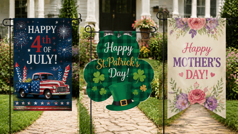 Three decorative garden flags featuring Fourth of July, St. Patrick’s Day and Mother’s Day themed outdoor yard flag designs displayed on stands in garden setting